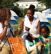 Michelle Obama knot tying with Girl Scouts